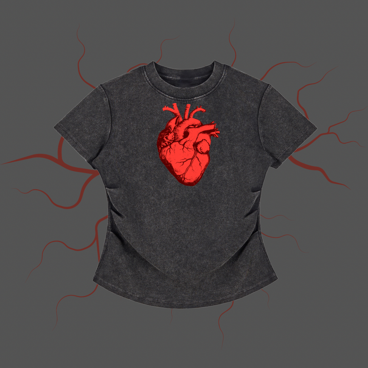 A dark gray acid-wash t-shirt featuring a detailed red anatomical heart graphic on the chest, presented against a dark gray background with red electrical or energy line illustrations.