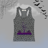 A gray racerback tank top with a black leopard print pattern and a purple Halloween-themed graphic of a bare tree and spiky plants on the front. The tank top is displayed against a gray background with spooky decorative elements including black spiderwebs in the top-left corner, black bats flying in the top-right, and a light blue-gray gradient at the bottom.
