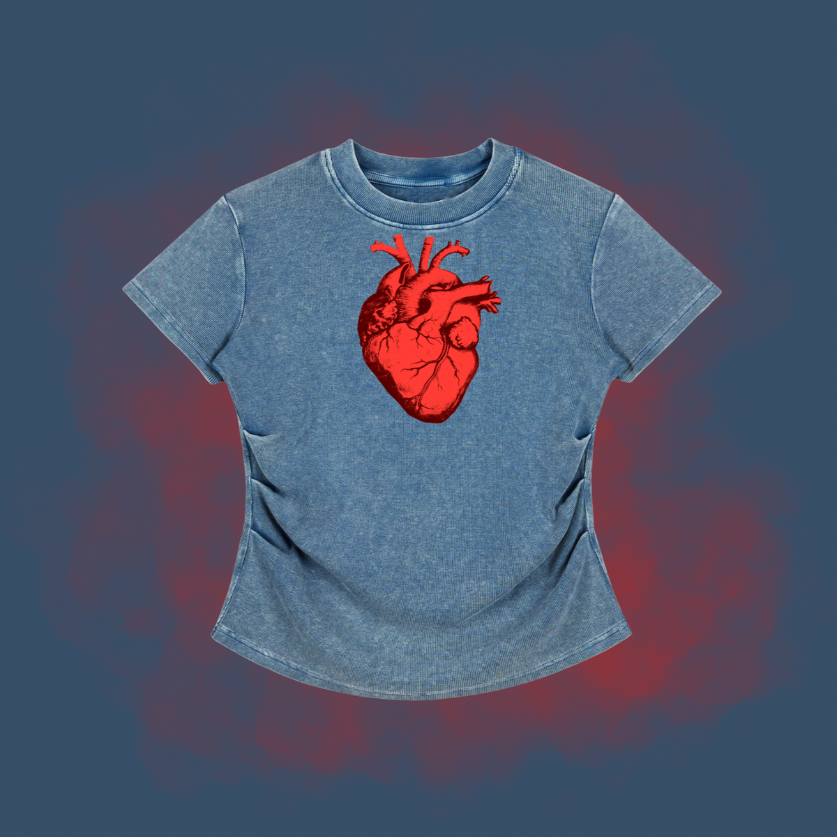A short-sleeve t-shirt in a washed blue denim-like fabric, featuring a prominent red anatomical heart graphic on the chest, set against a dark blue background with a red glow effect.