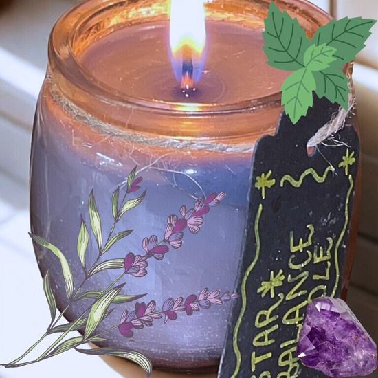 Black and dark grey candle in a jar with decorative black paper tag label with the text "star balance candle" and amethyst crystal in the background with a diagram of lavender leaves.