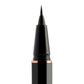 Black eyeliner pen with rose gold accents on a white background