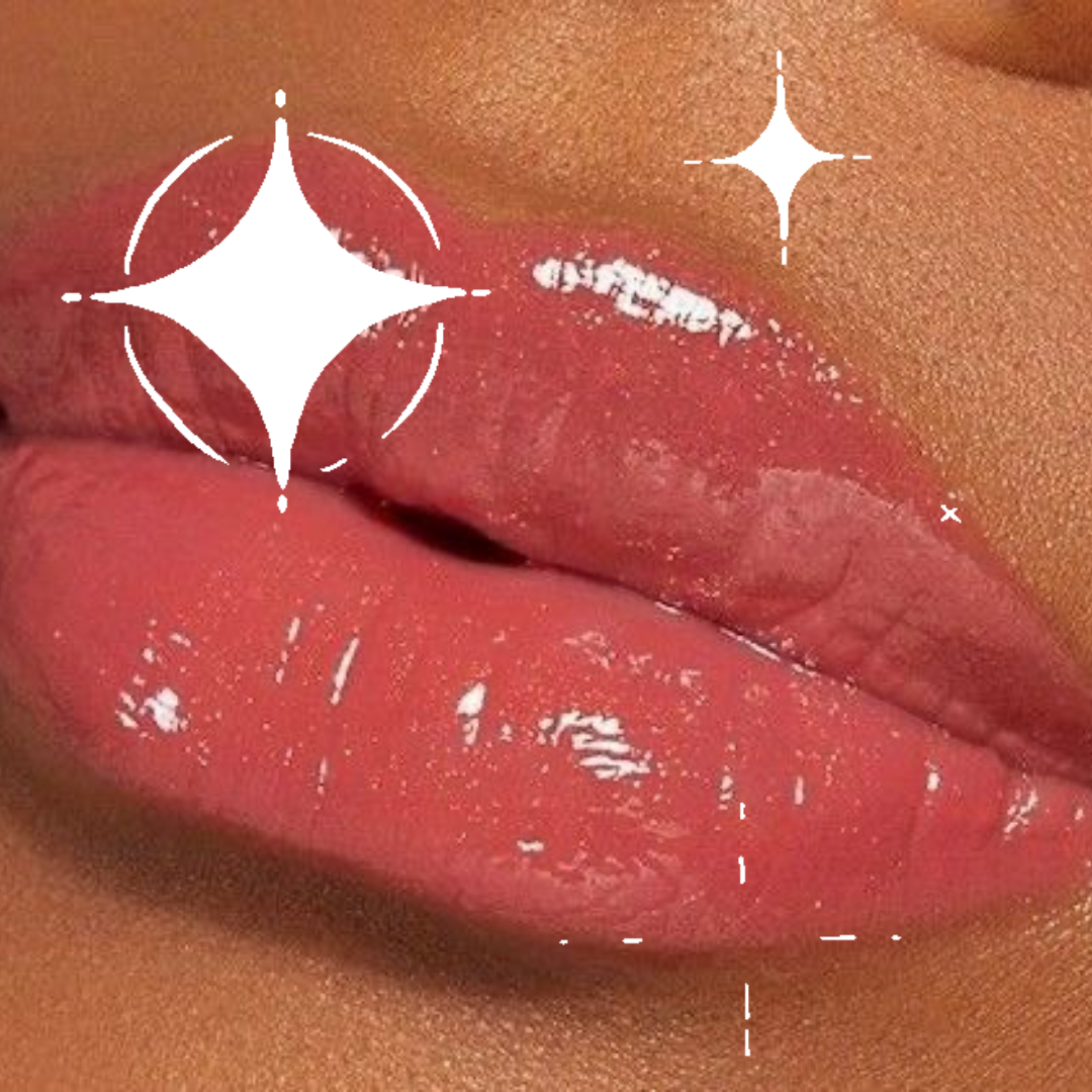 Close-up of glossy red lips with a sparkly finish on brown skin person.
