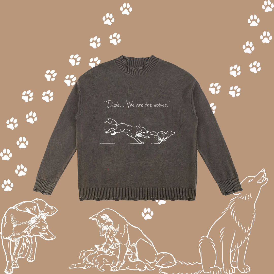 A dark charcoal grey crewneck sweater with a white graphic of a wolf and dog and the text &