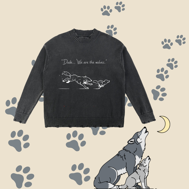 A dark charcoal grey long-sleeve knit sweater with a white graphic of two wolves and the text &