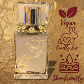 Perfume bottle with floral design on a gold background, featuring vegan, cruelty-free, and skin-friendly icons.